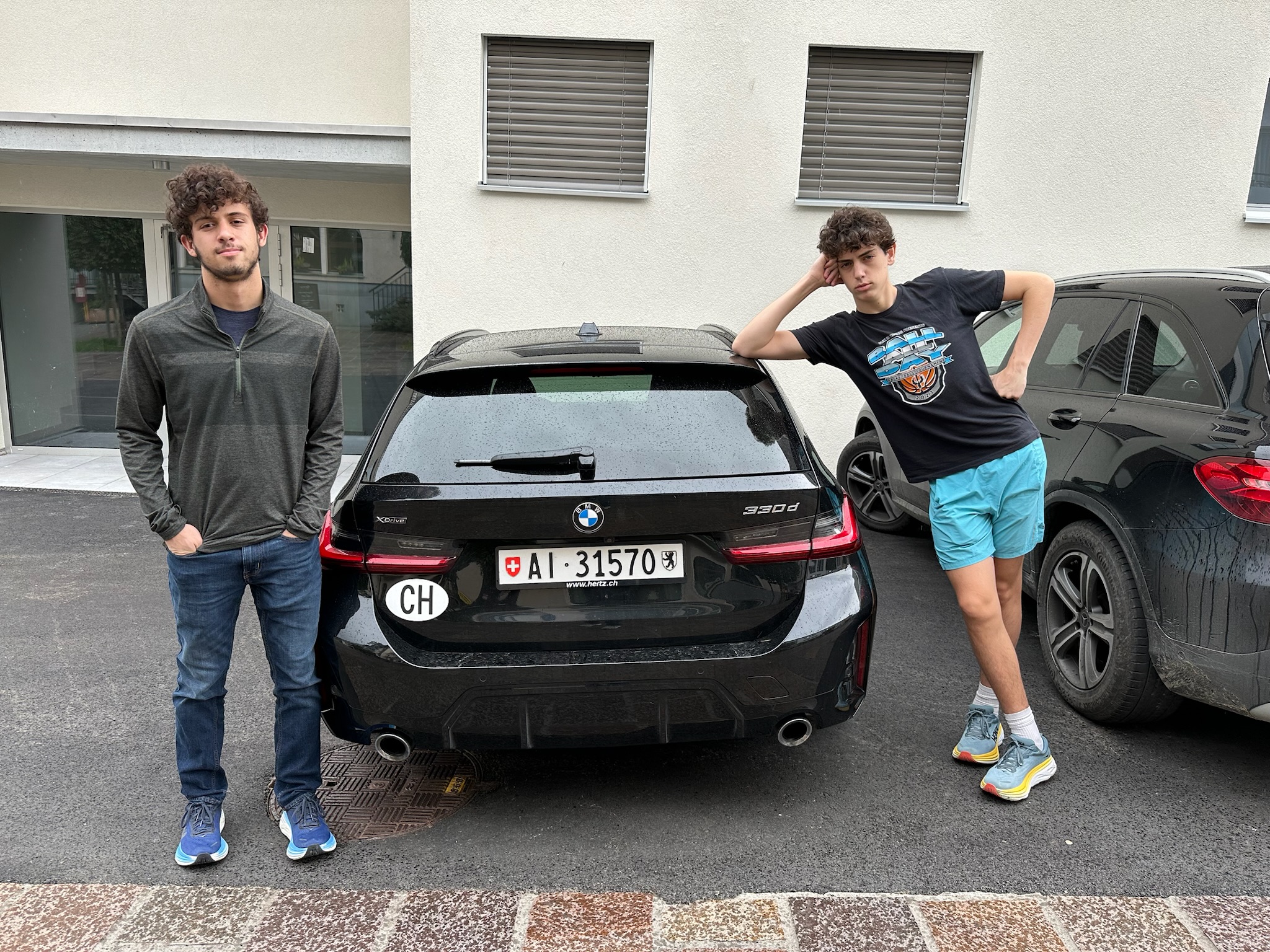 Grantham & Camden with our rental car at the Hotel de Fully